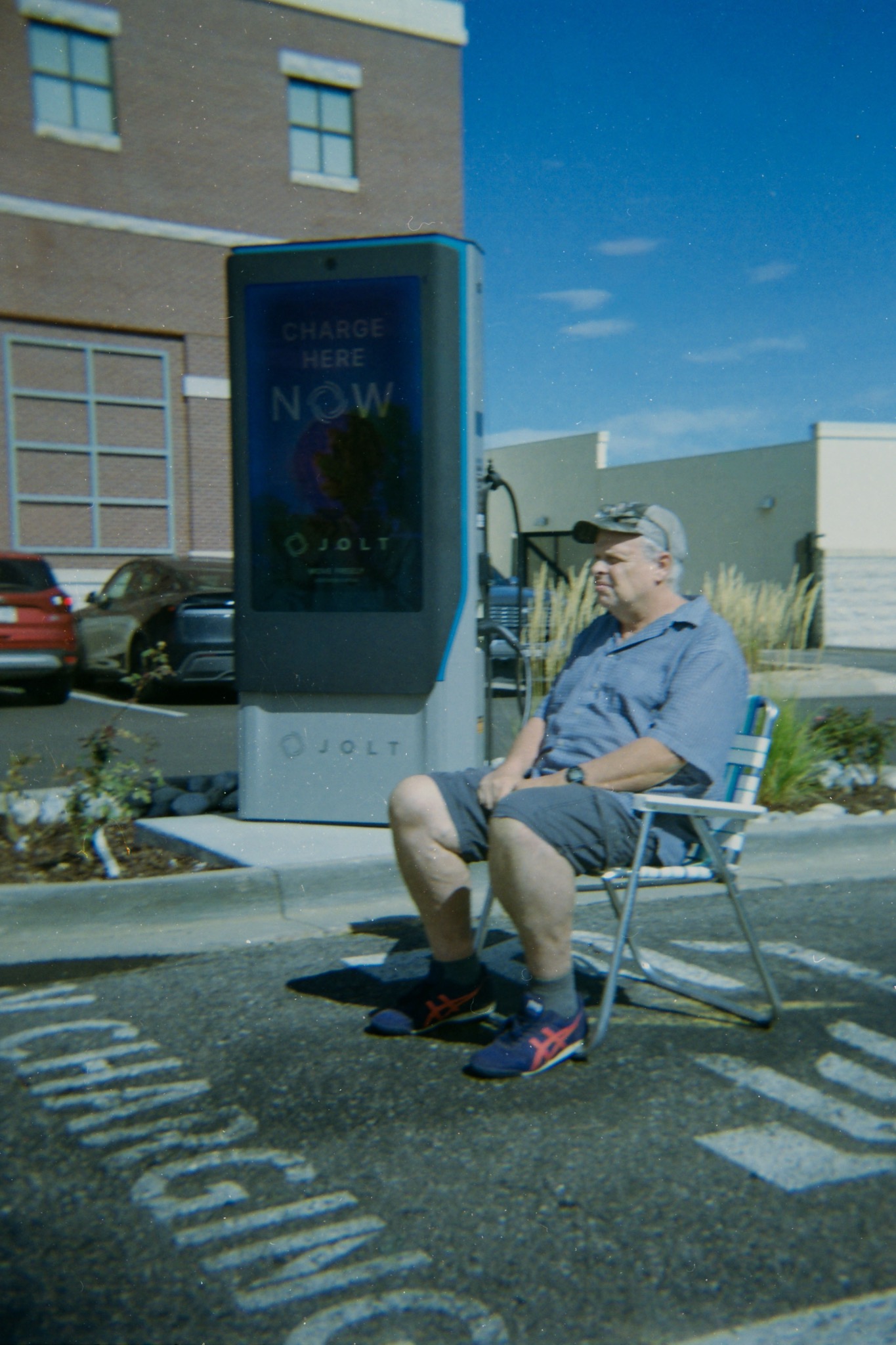 Performance photograph beside an electric vehicle charging station