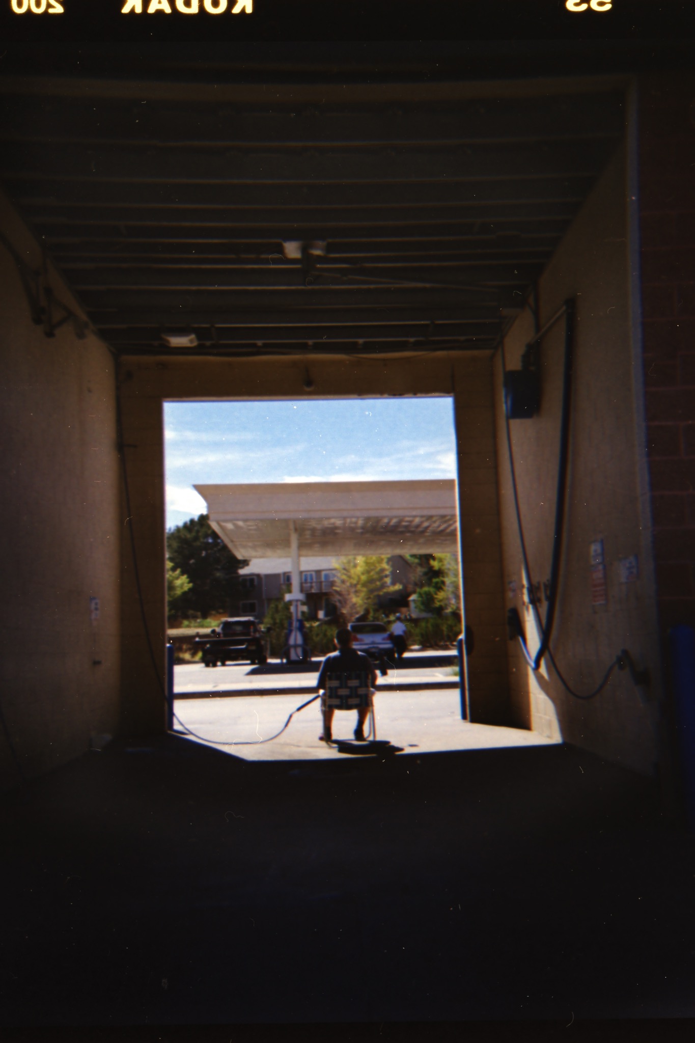 Performance photograph framed from inside a car wash bay